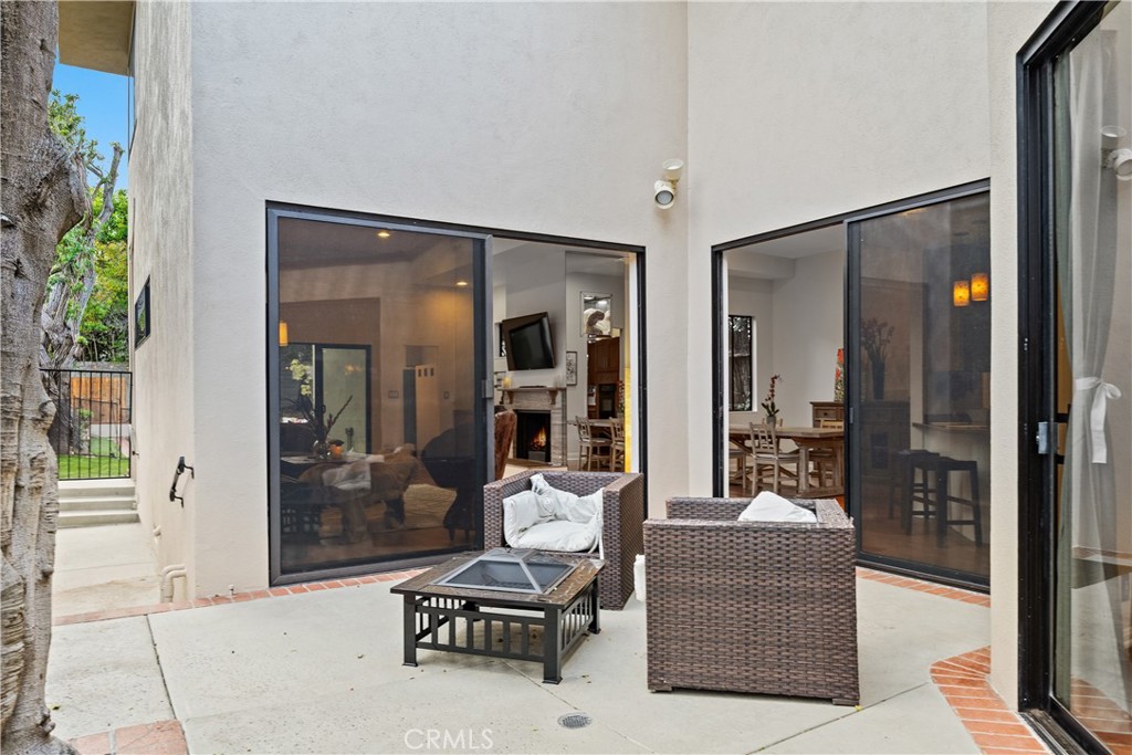 341 S Meadows Manhattan Beach, CA 90266 - Photo 9 of 54 a living room filled with furniture and a glass door