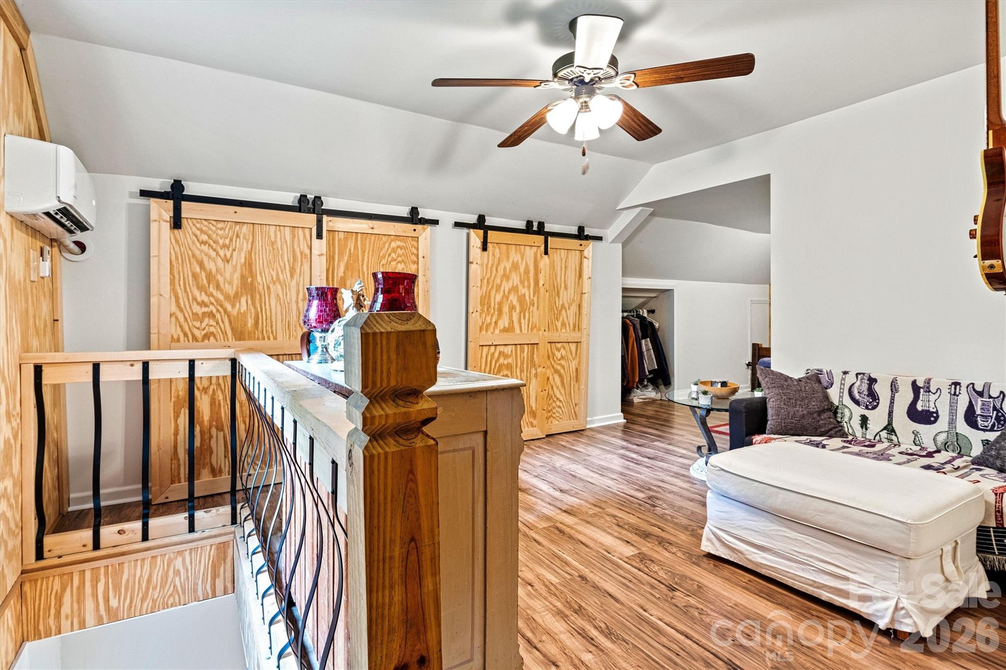 6051 Pointe W Lane Vale, NC 28168 - Photo 18 of 28 a living room with furniture a flat screen tv and a large window