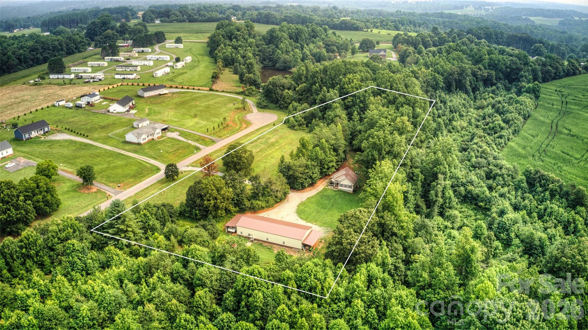 6051 Pointe W Lane Vale, NC 28168 - Photo 3 of 28 an aerial view of a residential houses with outdoor space and trees all around