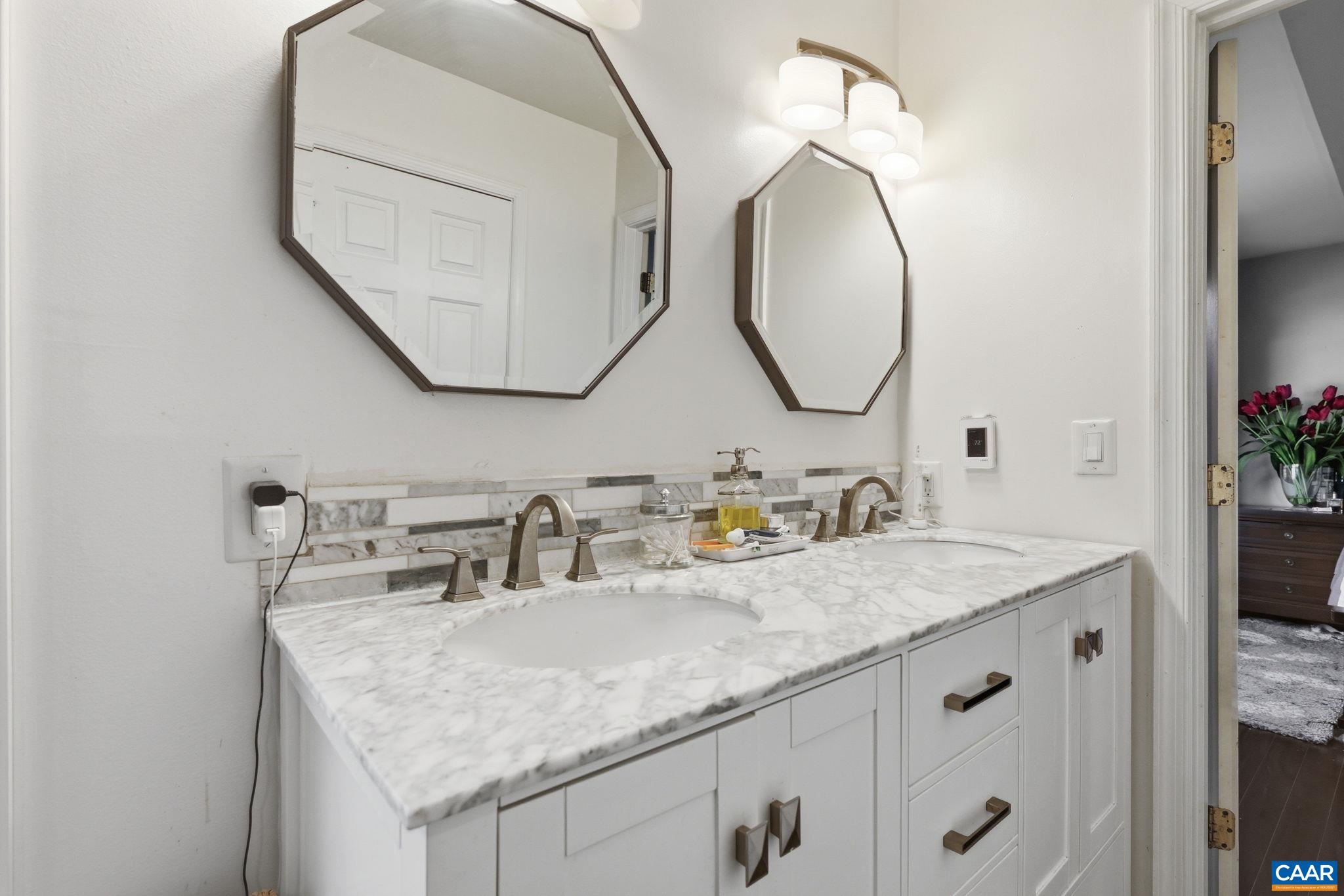 101 Marjorie Lane Ruckersville, VA 22968 - Photo 32 of 61 a bathroom with a granite countertop sink and a mirror