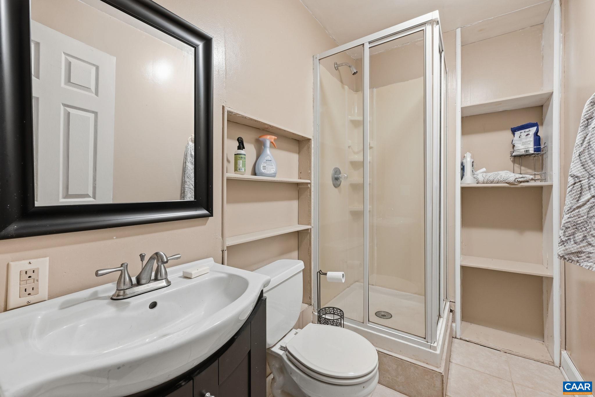 101 Marjorie Lane Ruckersville, VA 22968 - Photo 44 of 61 a bathroom with a sink a toilet and shower