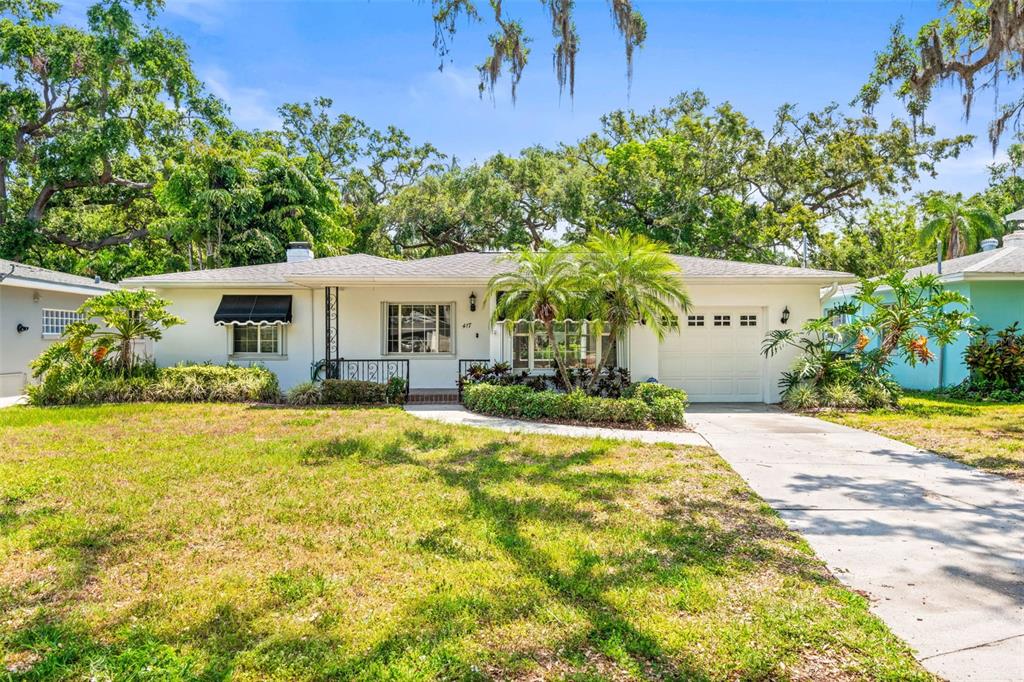 417 Broadway Dunedin, FL 34698 - Photo 1 of 1 a front view of a house with a yard