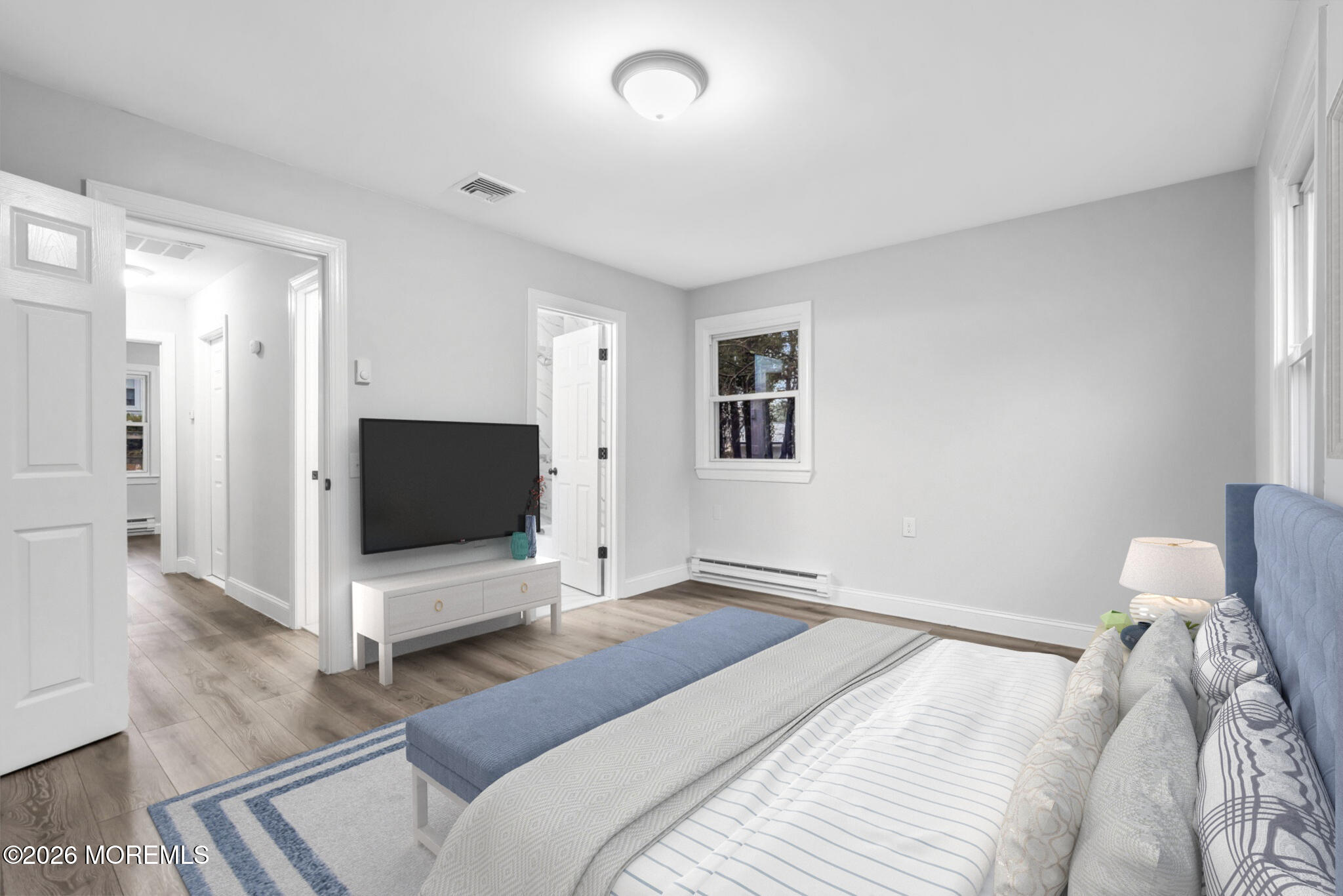 29 Keene Street, Unit 70 Whiting, NJ 08759 - Photo 11 of 18 a bedroom with furniture and a flat screen tv