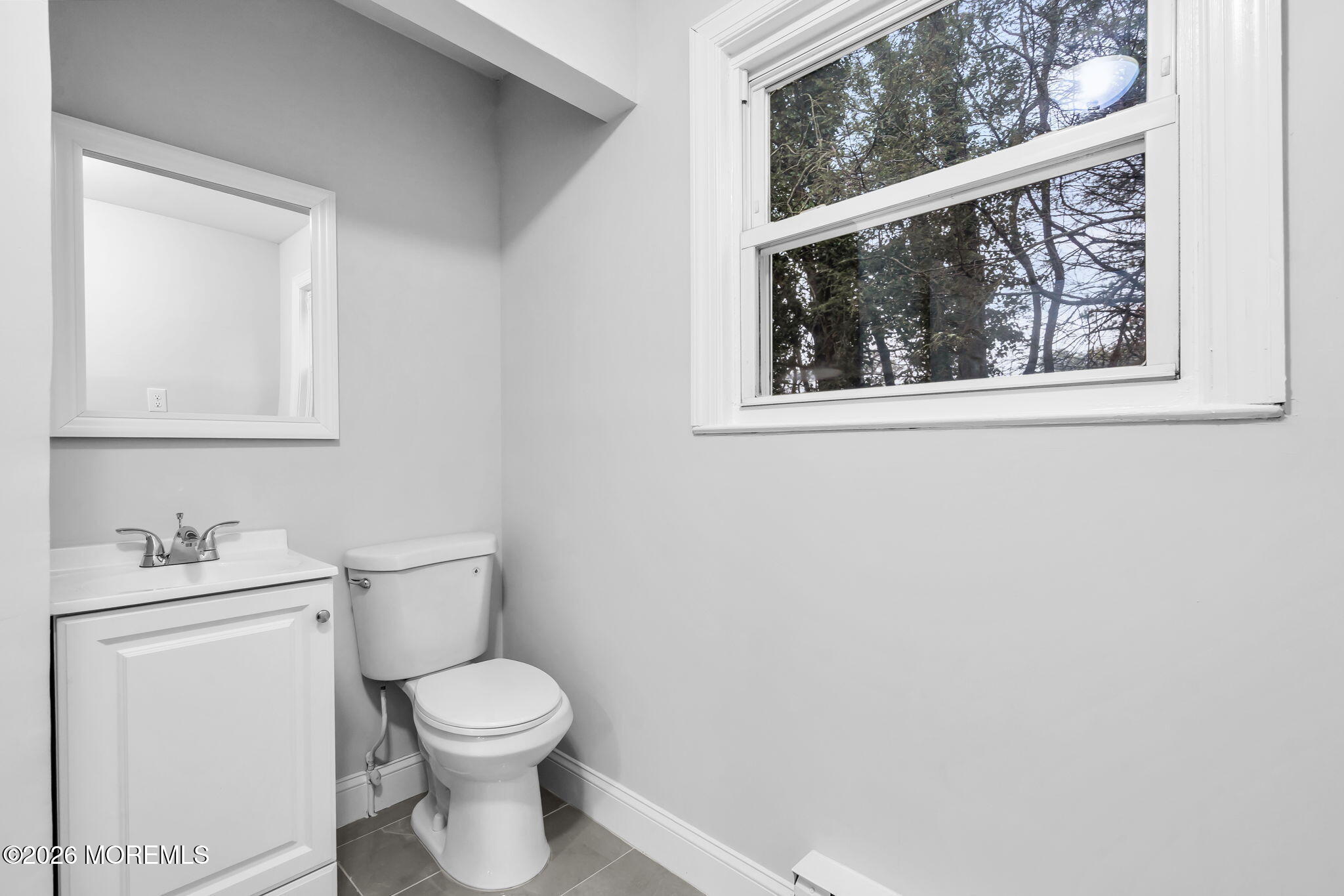 29 Keene Street, Unit 70 Whiting, NJ 08759 - Photo 16 of 18 a white toilet sitting next to a bathroom sink
