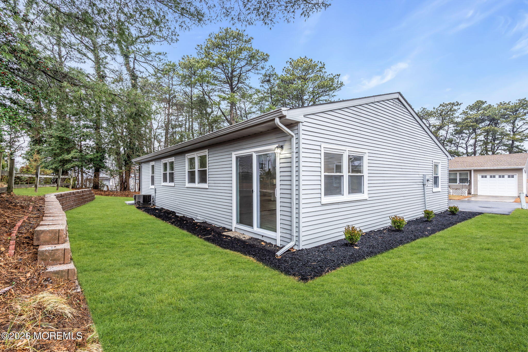 29 Keene Street, Unit 70 Whiting, NJ 08759 - Photo 18 of 18 a front view of a house with a garden