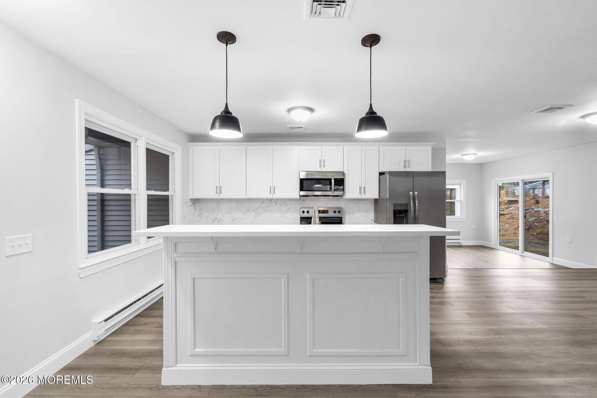 29 Keene Street, Unit 70 Whiting, NJ 08759 - Photo 5 of 18 a kitchen with stainless steel appliances granite countertop a refrigerator a oven a white counter space and wooden floor