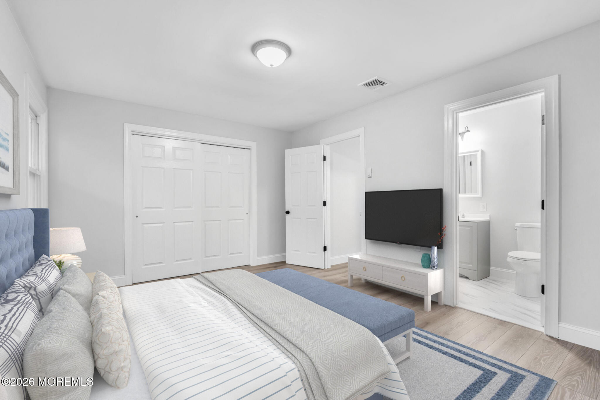 29 Keene Street, Unit 70 Whiting, NJ 08759 - Photo 10 of 18 a bedroom with a bed and a flat screen tv