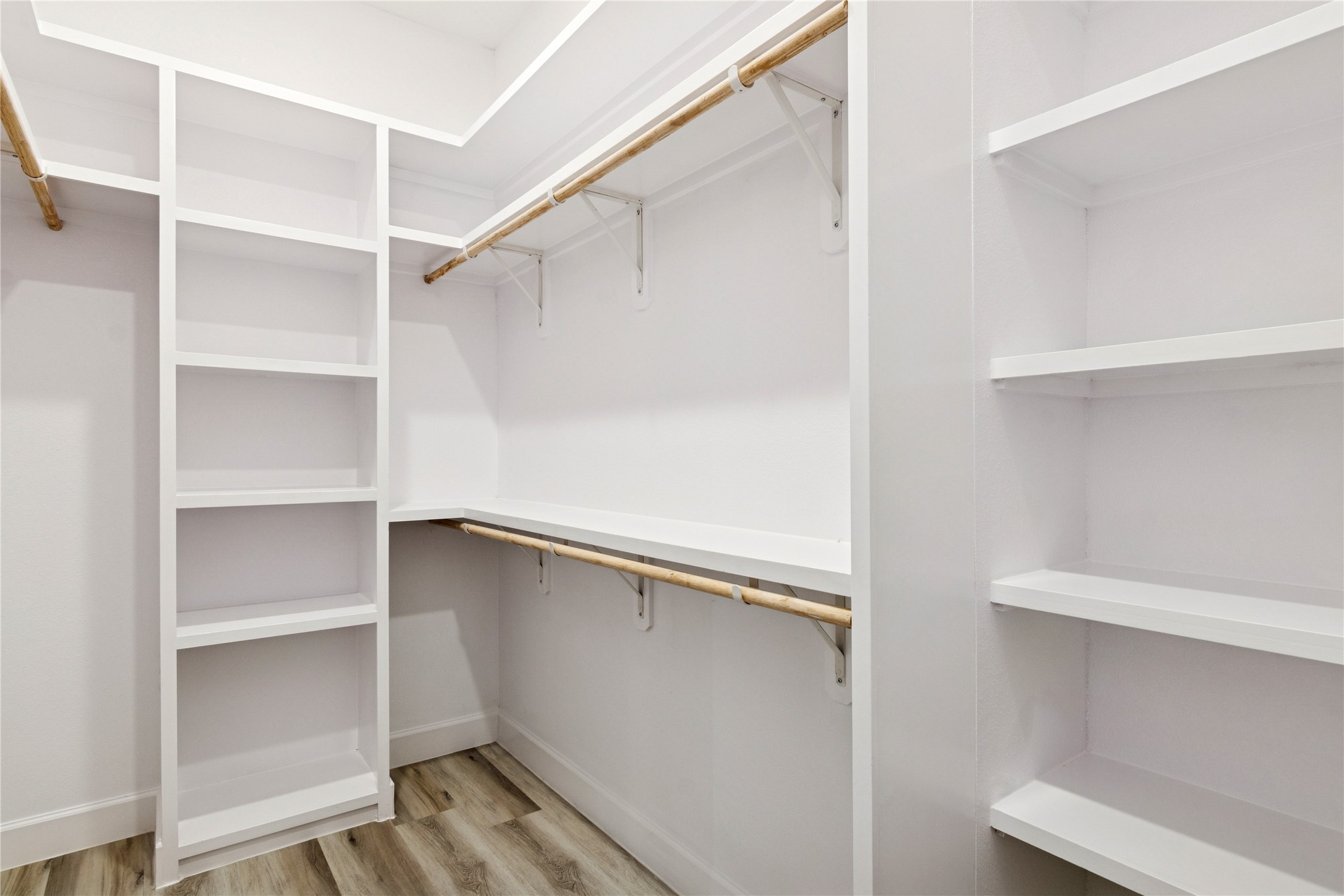 5766 Ward Bend Road Sealy, TX 77474 - Photo 32 of 45 a view of walk in closet with empty racks