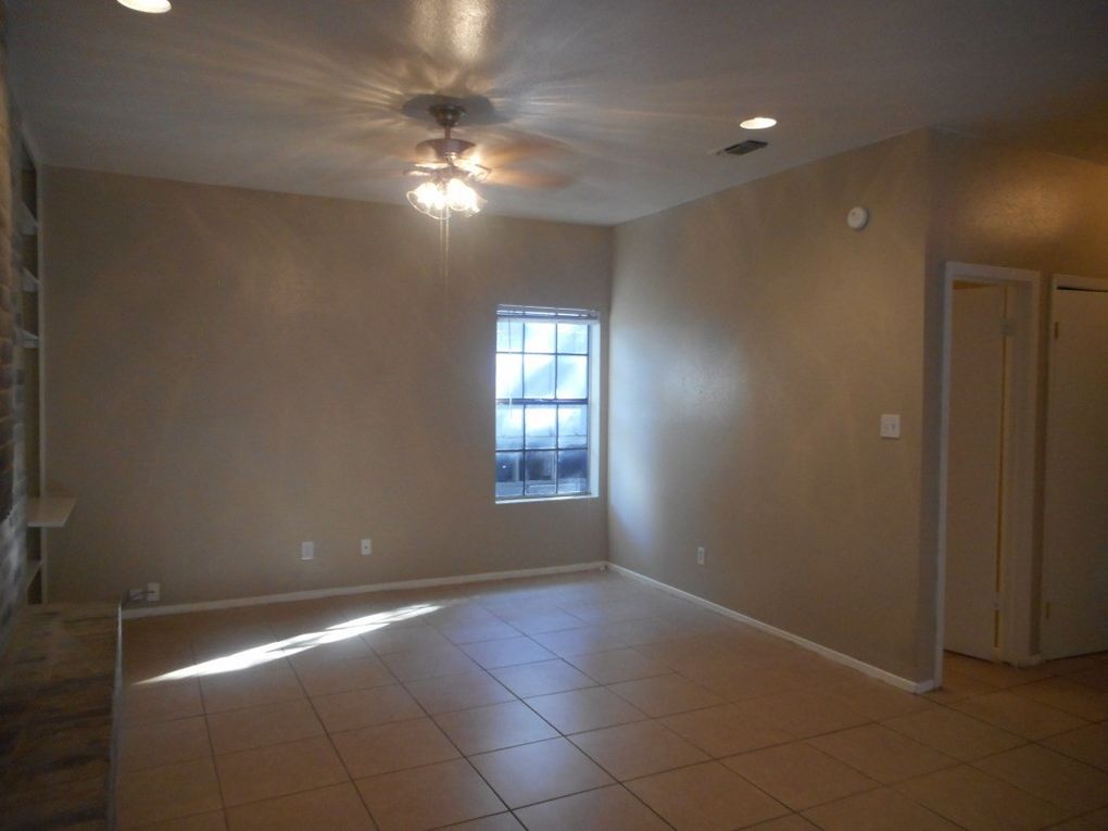3106 Cedar Street Austin, TX 78705 - Photo 10 of 19 Unfurnished room featuring recessed lighting, light tile patterned floors, and a ceiling fan