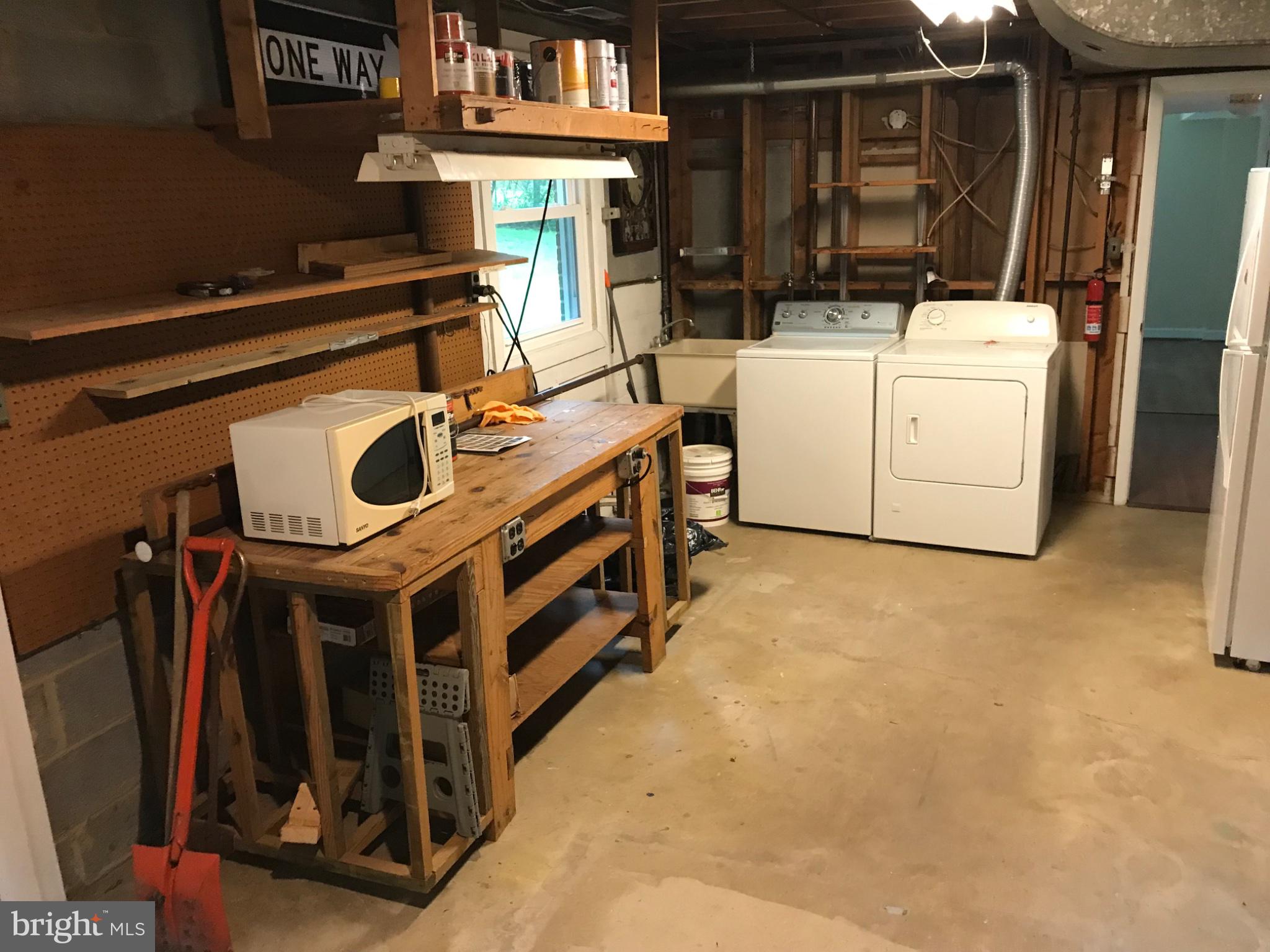 113 Kingsley Road Southwest Vienna, VA 22180 - Photo 31 of 40 Functional utility space with laundry.