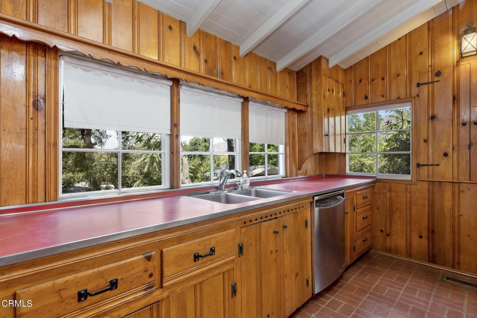 9710 Mistletoe Road Tujunga, CA 91042 - Photo 19 of 68 a view of a kitchen with a sink and dishwasher next to a window