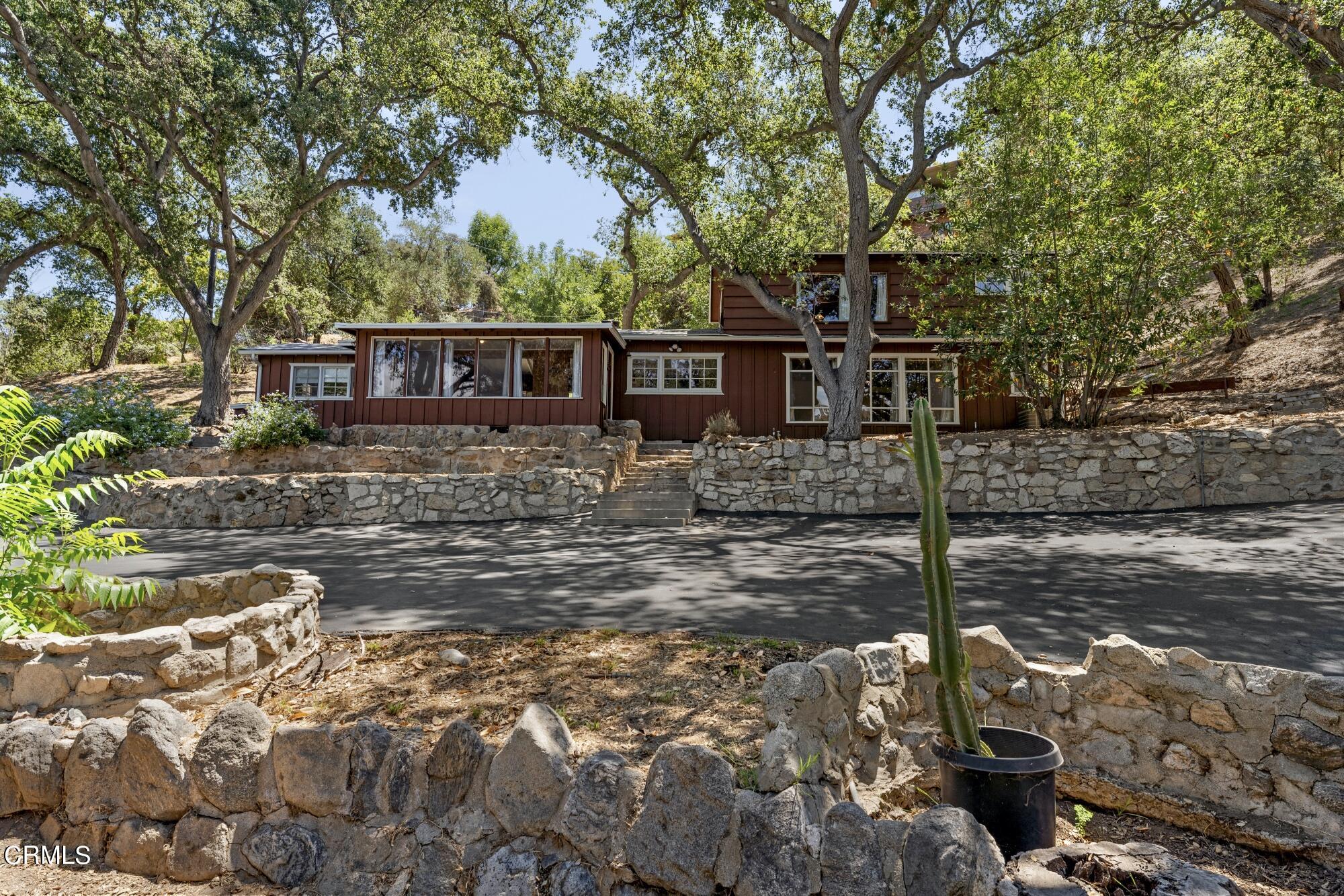 9710 Mistletoe Road Tujunga, CA 91042 - Photo 2 of 68 a front view of a house with garden