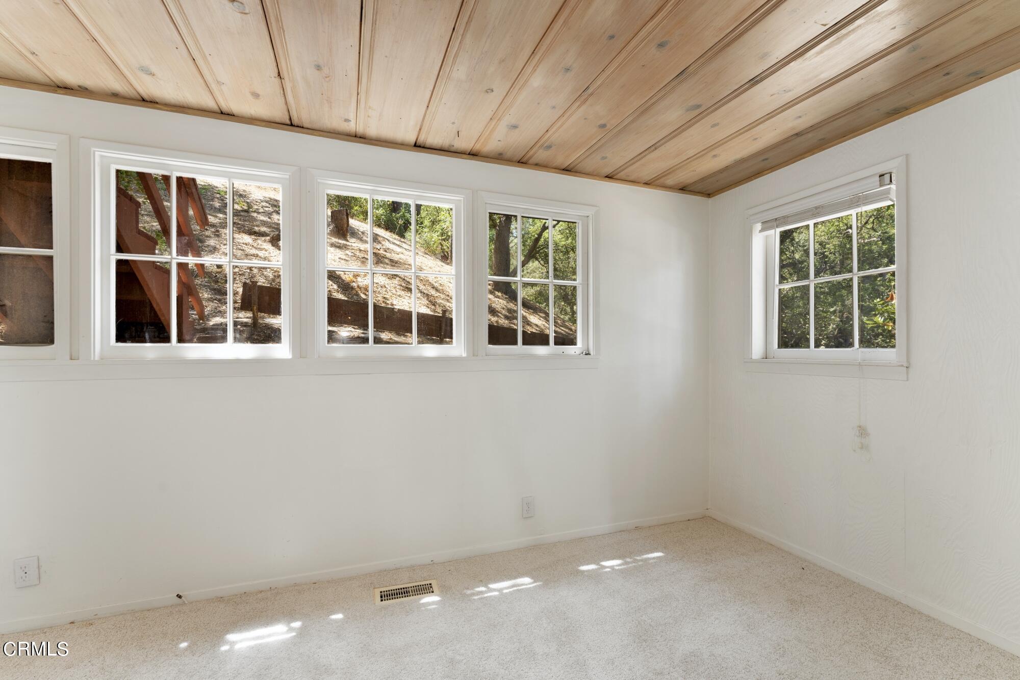 9710 Mistletoe Road Tujunga, CA 91042 - Photo 24 of 68 a view of an empty room with a window