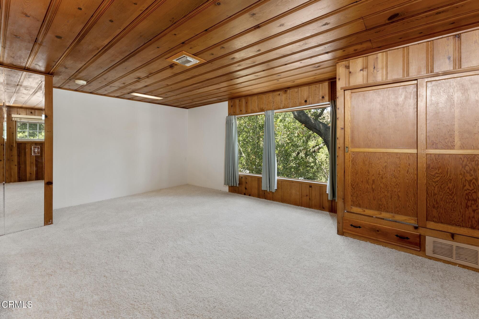 9710 Mistletoe Road Tujunga, CA 91042 - Photo 28 of 68 a view of an empty room with a window