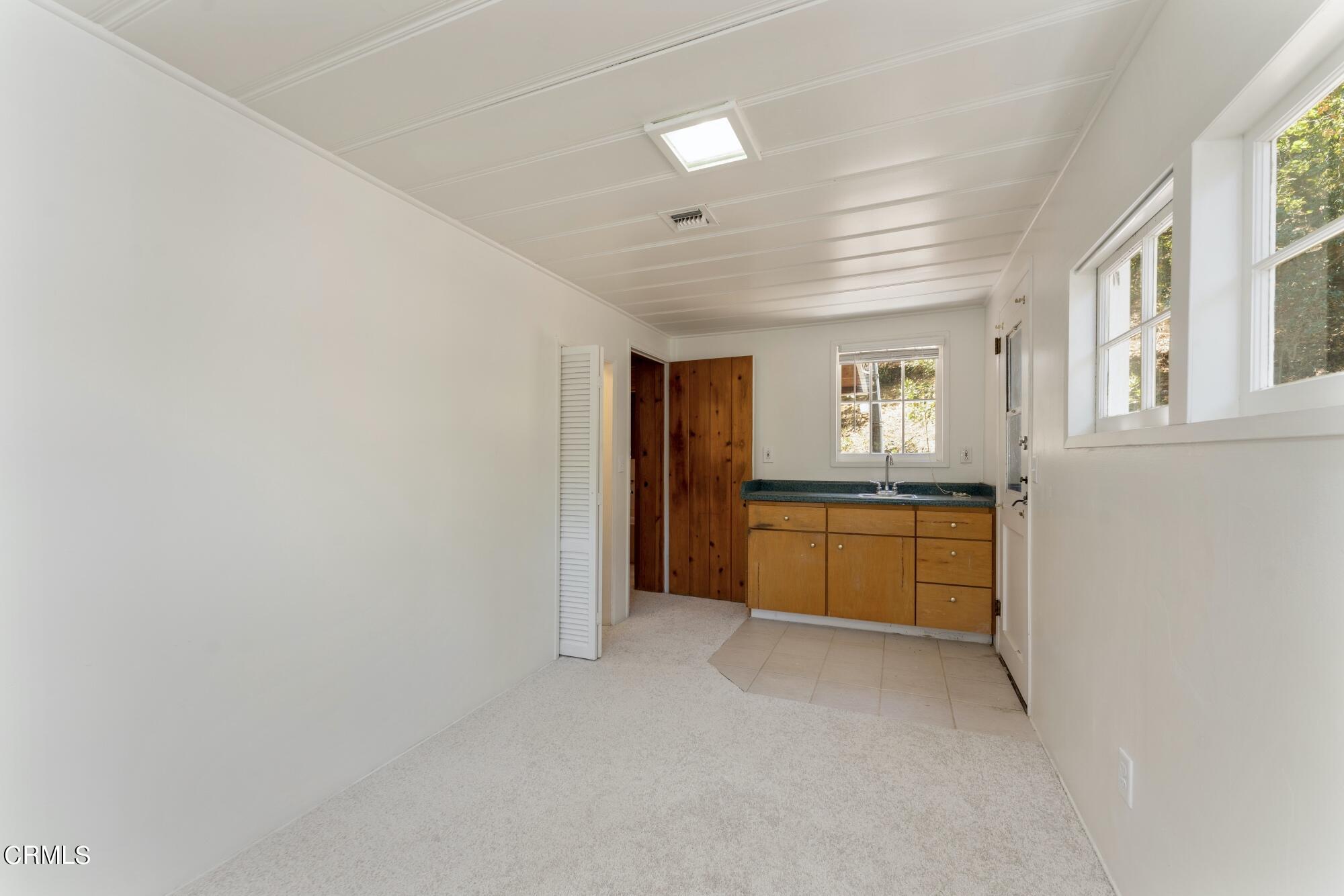 9710 Mistletoe Road Tujunga, CA 91042 - Photo 34 of 68 a view of an empty room with a kitchen