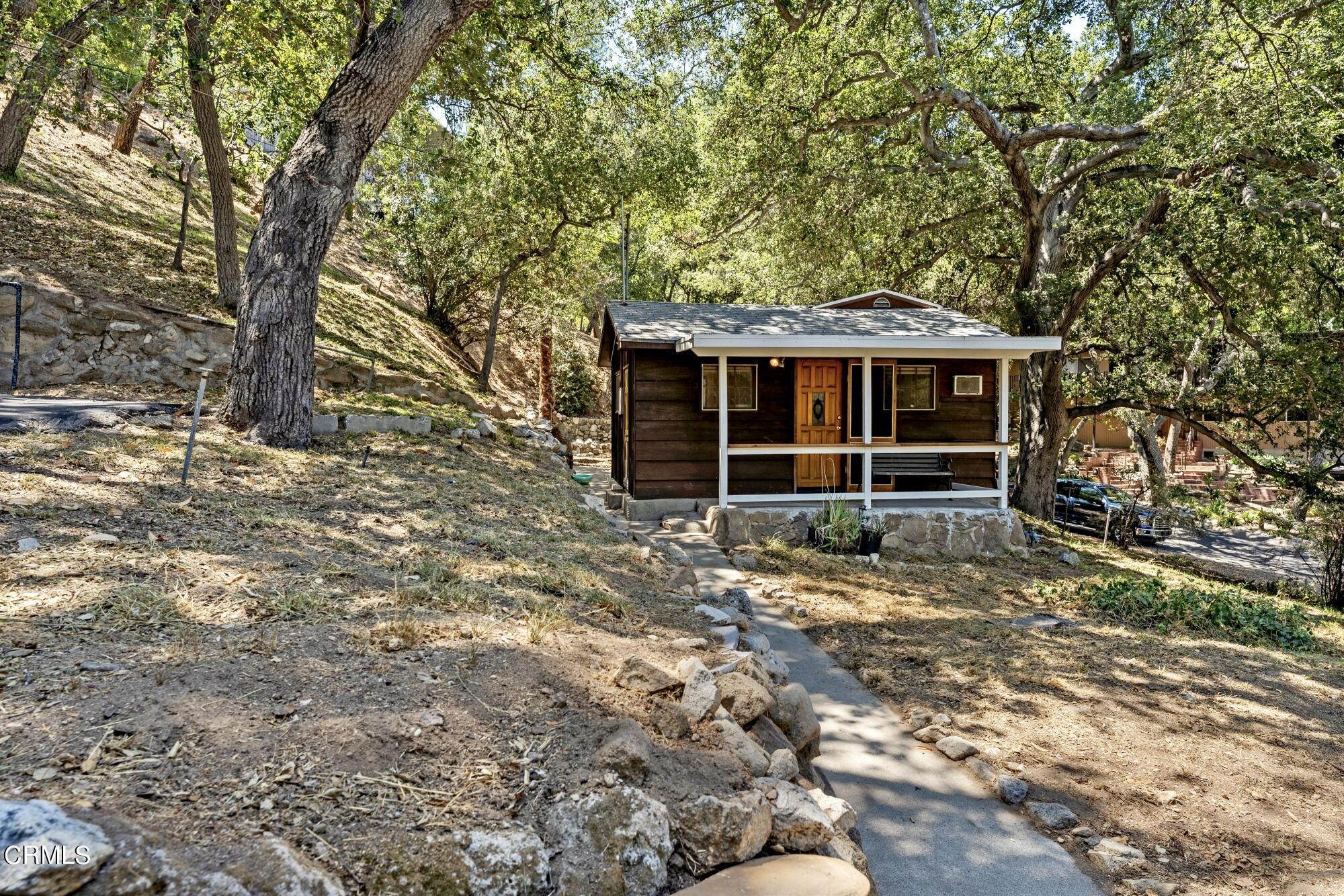 9710 Mistletoe Road Tujunga, CA 91042 - Photo 40 of 68 a house with a tree in front of it