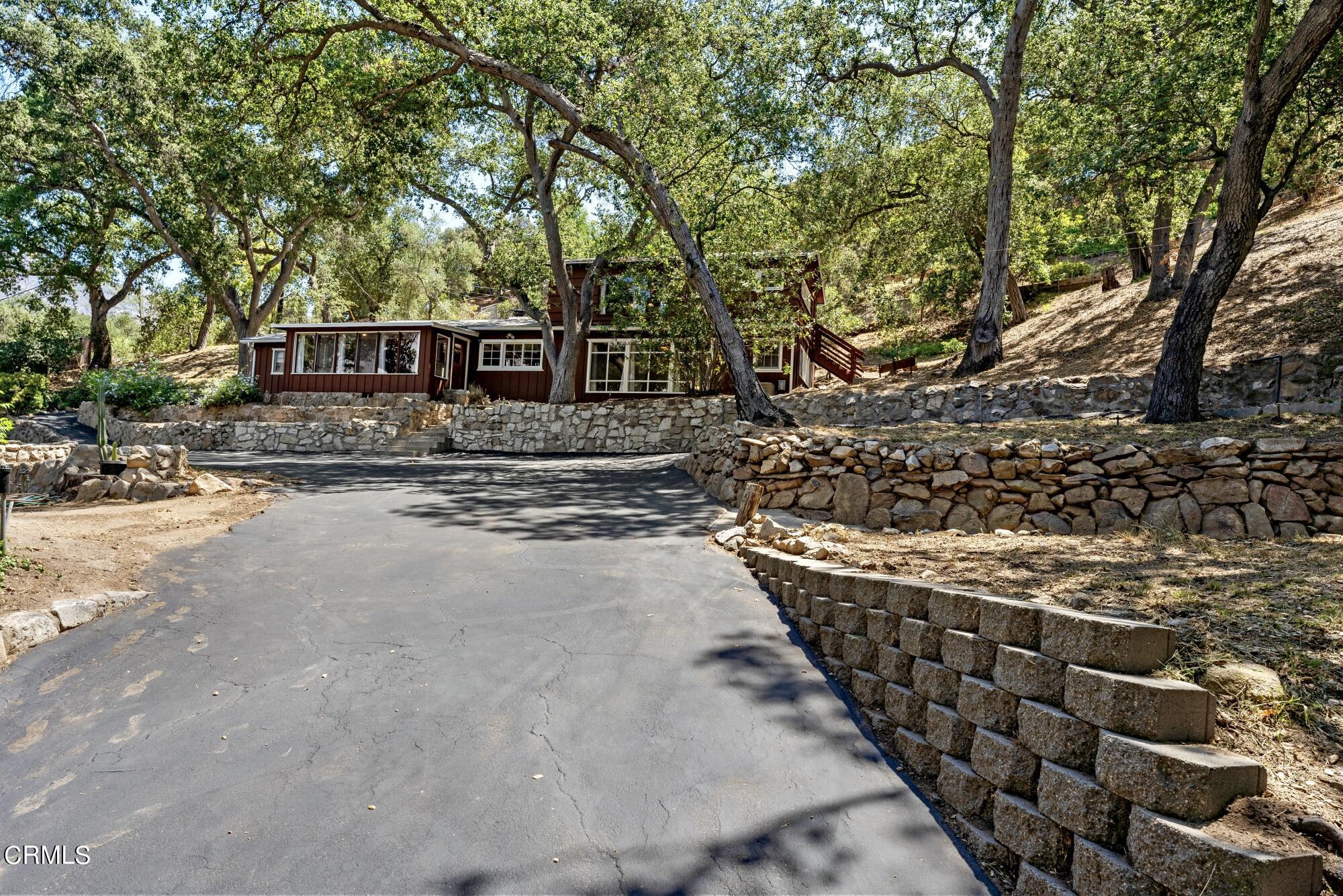 9710 Mistletoe Road Tujunga, CA 91042 - Photo 4 of 68 a front view of a house with a yard