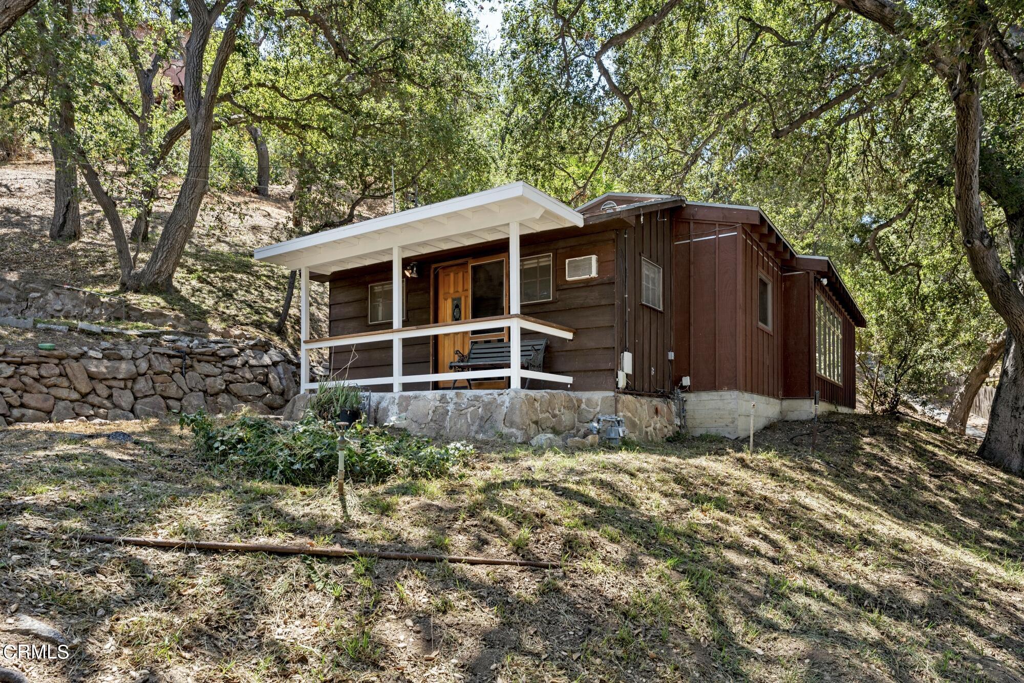 9710 Mistletoe Road Tujunga, CA 91042 - Photo 41 of 68 a front view of a house with garden
