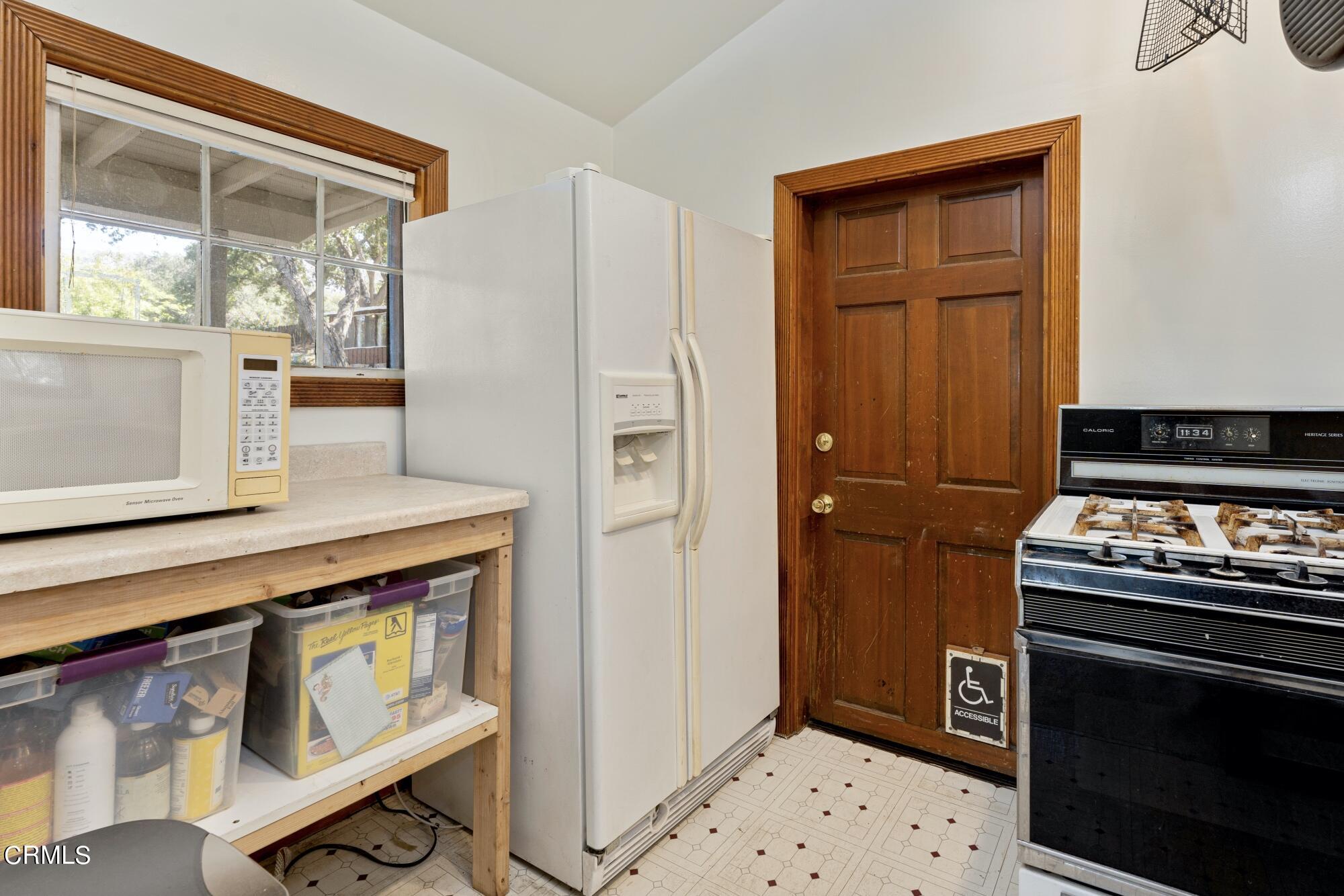 9710 Mistletoe Road Tujunga, CA 91042 - Photo 46 of 68 a kitchen with a stove and a microwave