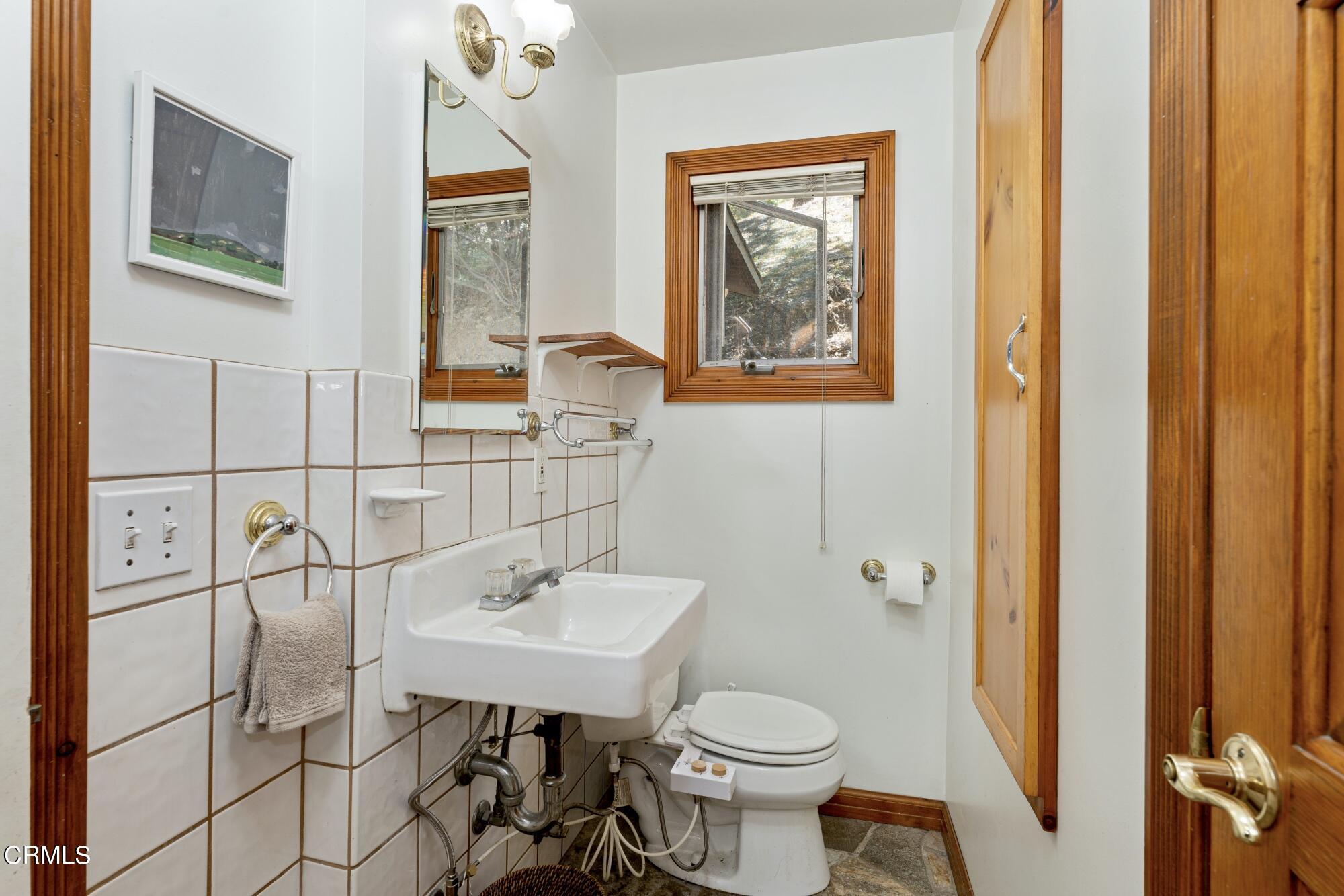 9710 Mistletoe Road Tujunga, CA 91042 - Photo 49 of 68 a bathroom with a sink toilet and shower