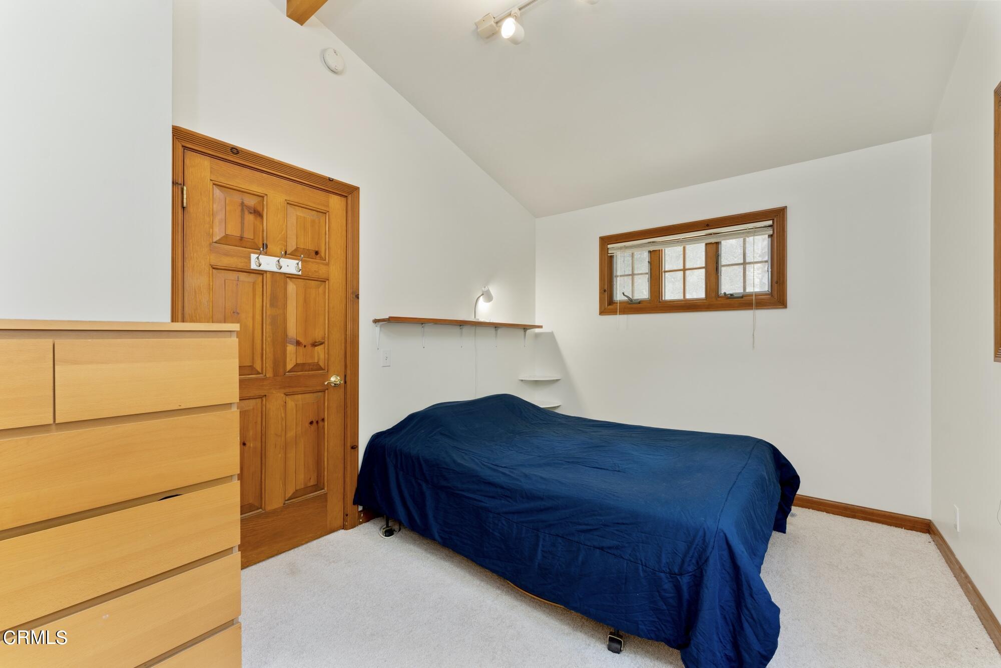 9710 Mistletoe Road Tujunga, CA 91042 - Photo 54 of 68 a living room with a bed and a window