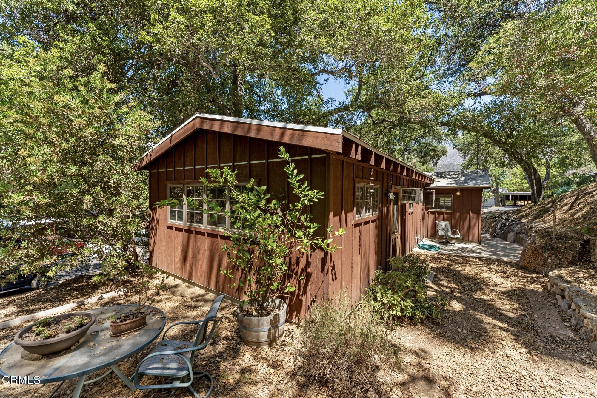 9710 Mistletoe Road Tujunga, CA 91042 - Photo 57 of 68 a view of a wooden house with a yard