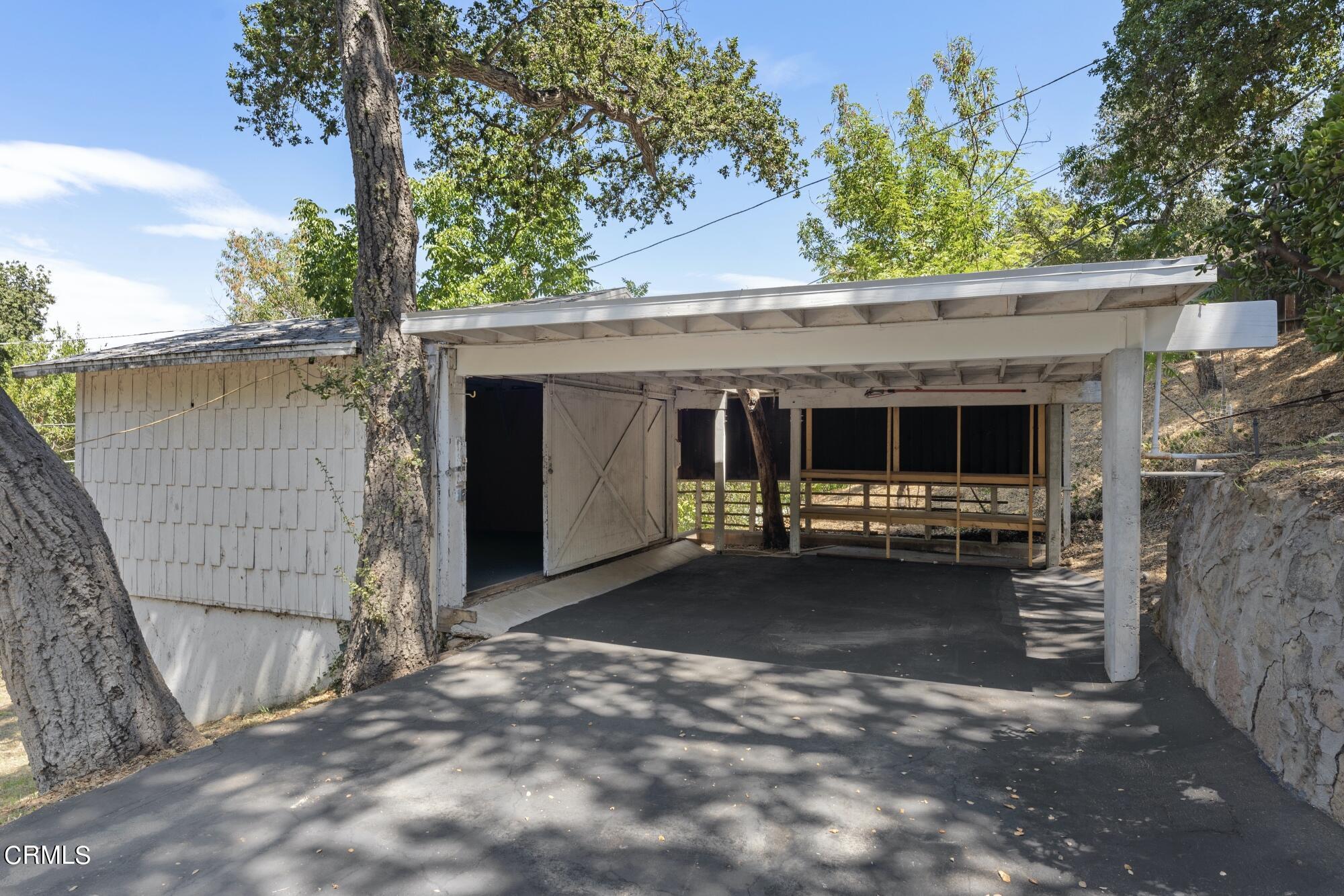 9710 Mistletoe Road Tujunga, CA 91042 - Photo 58 of 68 a view of a house with a large tree and a big yard