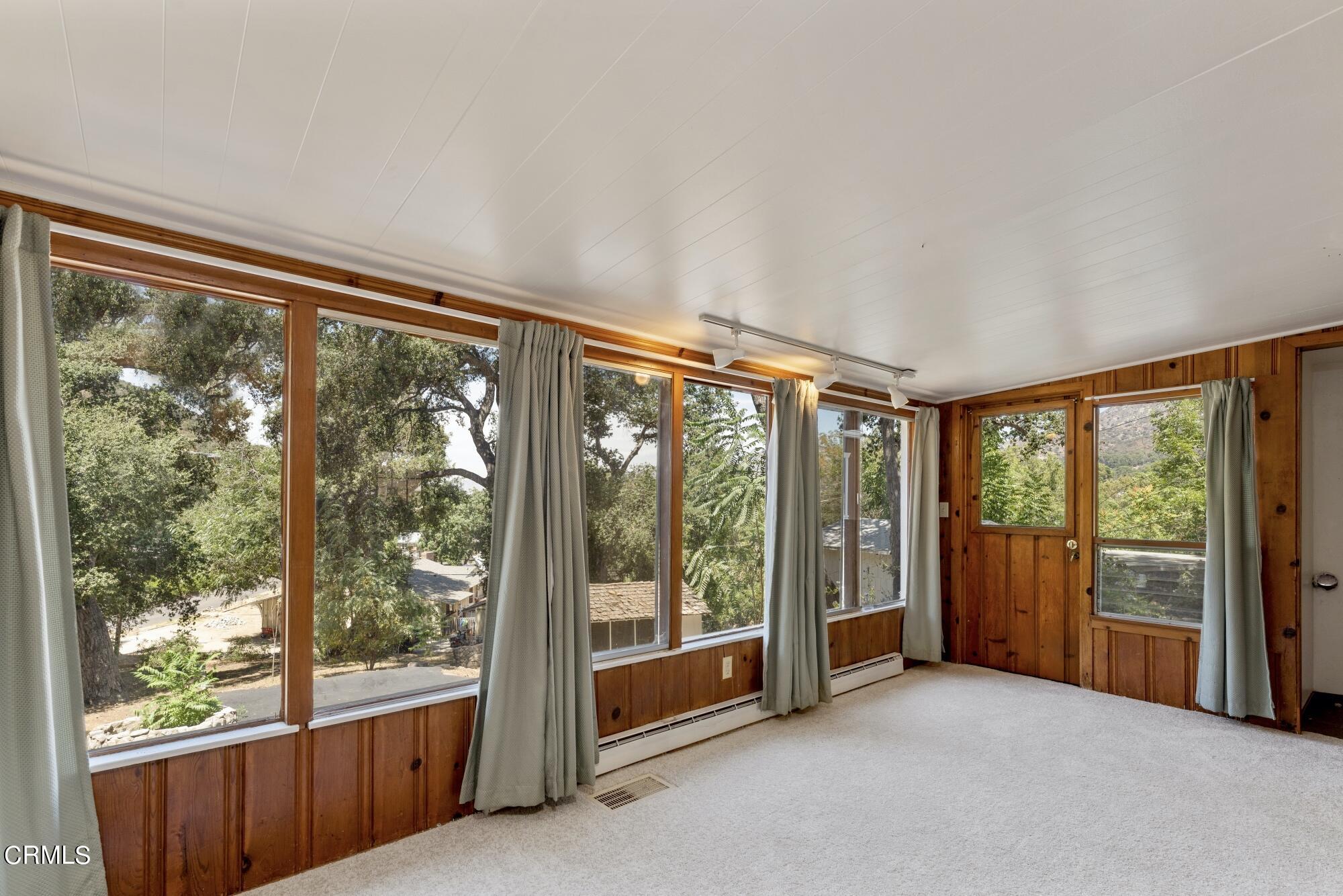 9710 Mistletoe Road Tujunga, CA 91042 - Photo 8 of 68 a view of an empty room with a large window