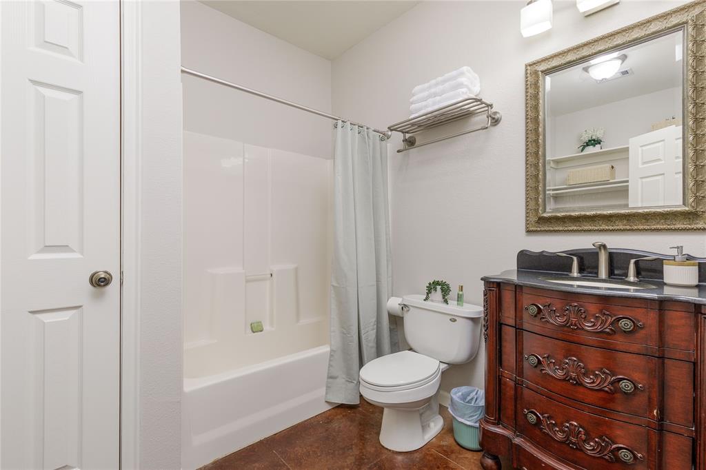 1878 North Lincoln Park Road Van Alstyne, TX 75495 - Photo 11 of 32 a bathroom with a toilet a sink and a bathtub