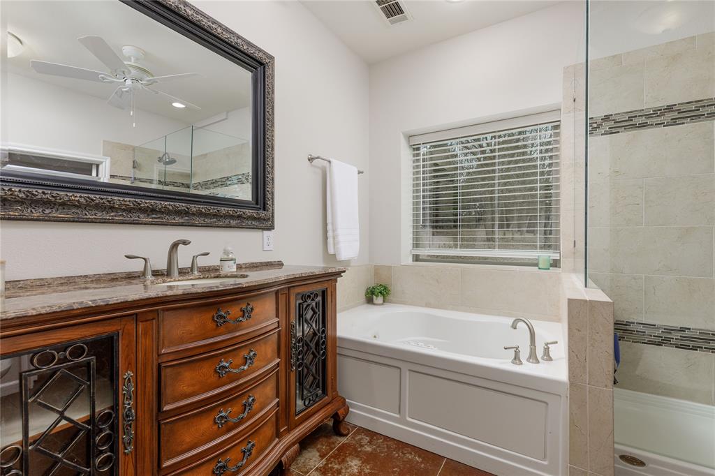1878 North Lincoln Park Road Van Alstyne, TX 75495 - Photo 15 of 32 a bathroom with a granite countertop sink mirror and bathtub