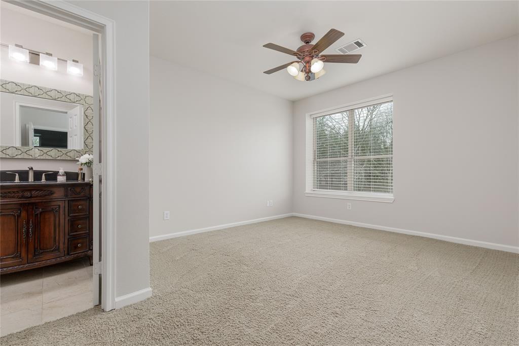 1878 North Lincoln Park Road Van Alstyne, TX 75495 - Photo 17 of 32 an empty room with windows and ceiling fan
