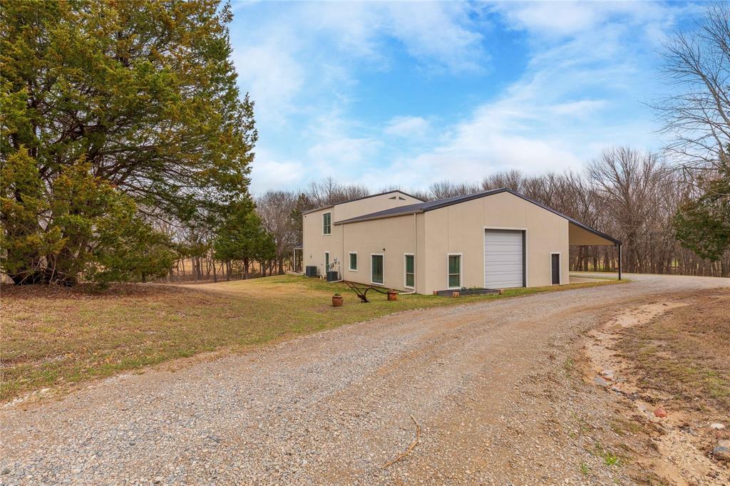 1878 North Lincoln Park Road Van Alstyne, TX 75495 - Photo 22 of 32 a view of house with yard and trees in the background