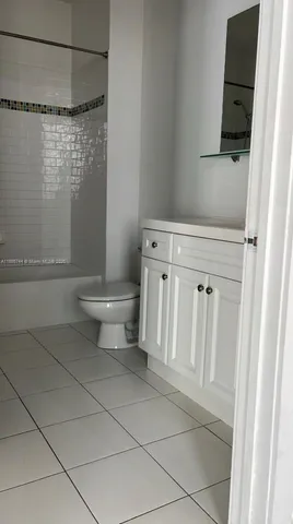 a view of storage and utility room with wooden floor