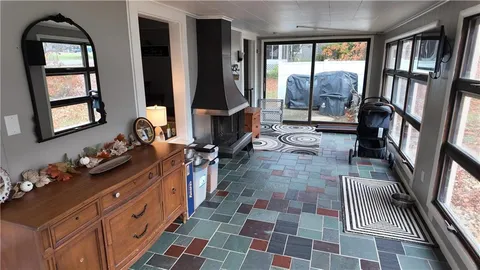 a bathroom with double vanity and a mirror