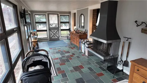 a view of a livingroom with furniture and staircase