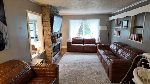 a living room with furniture or couch and a window
