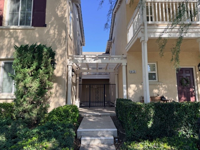 a front view of a house with plants