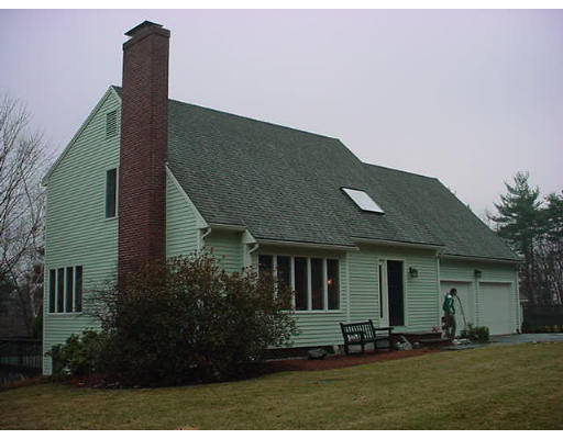 12 Uplands Road Littleton, MA 01460 - Photo 1 of 6 a front view of a house with a yard