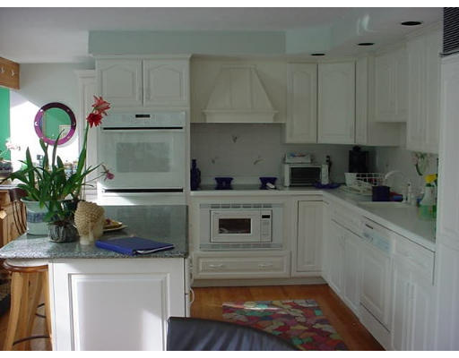 12 Uplands Road Littleton, MA 01460 - Photo 4 of 6 a kitchen with a white cabinets and window