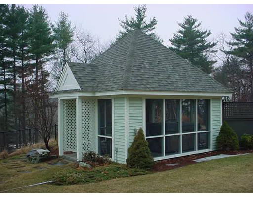12 Uplands Road Littleton, MA 01460 - Photo 5 of 6 a front view of a house with a yard