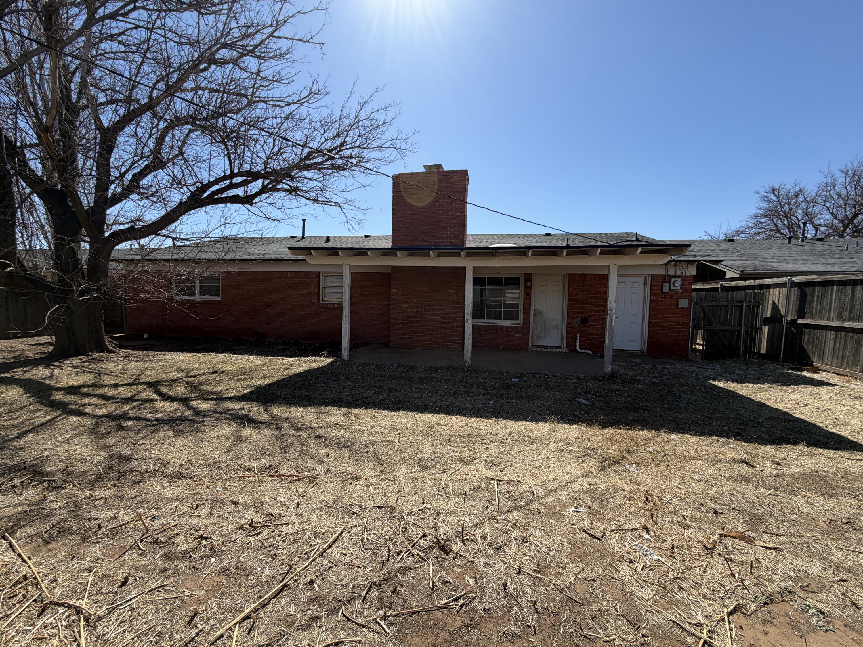 2010 52nd Street Lubbock, TX 79412 - Photo 13 of 13 a front view of a house with a yard