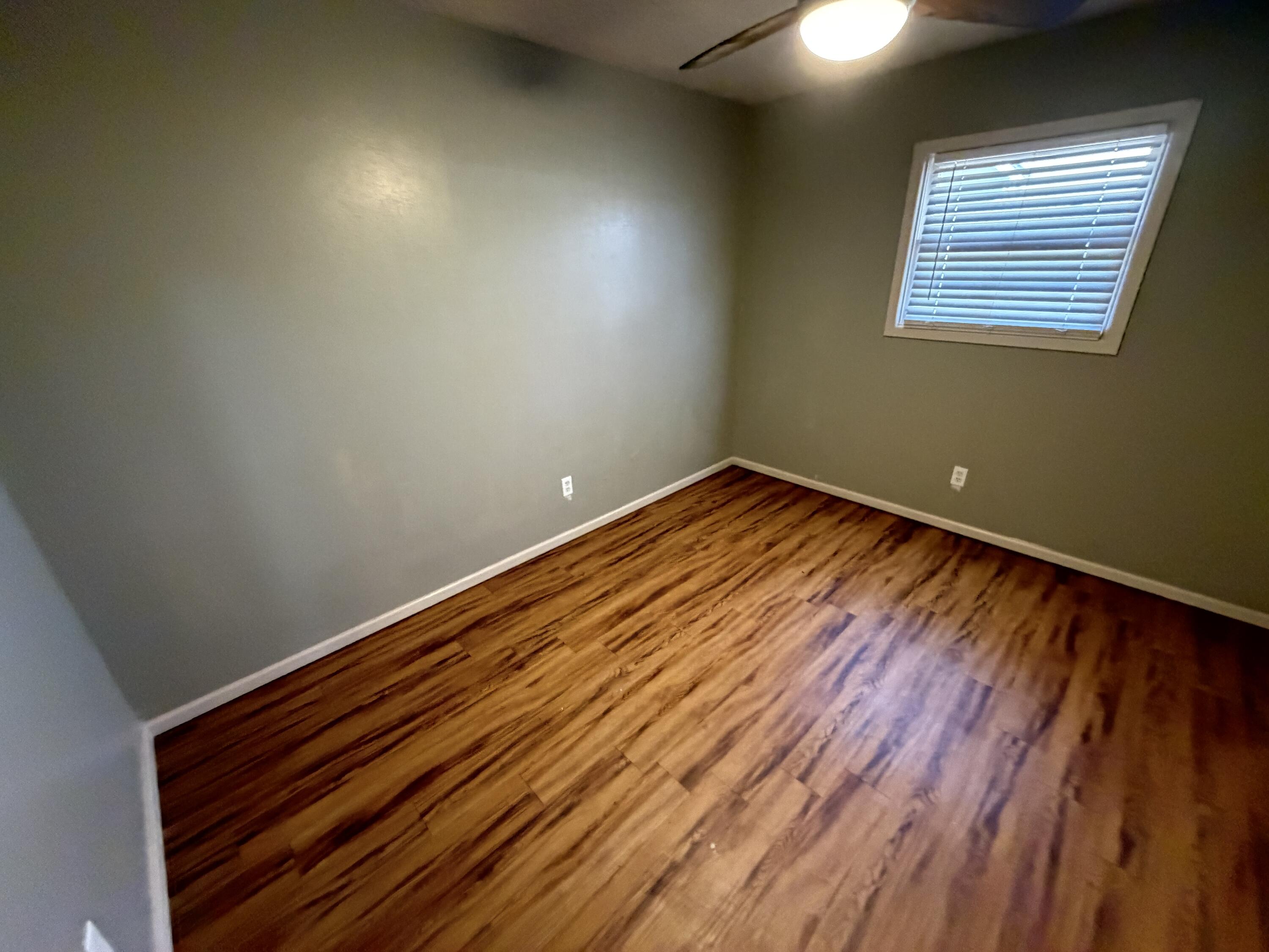 2010 52nd Street Lubbock, TX 79412 - Photo 10 of 13 a view of empty room with wooden floor