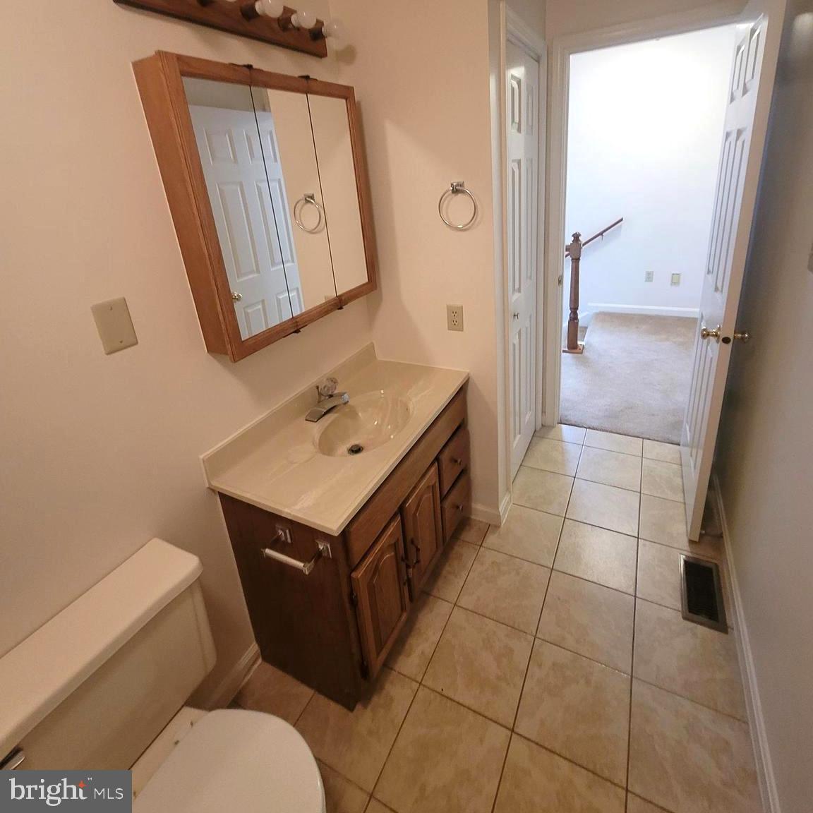 71 Leatherman Drive Falling Waters, WV 25419 - Photo 15 of 22 a bathroom with a sink a toilet and mirror
