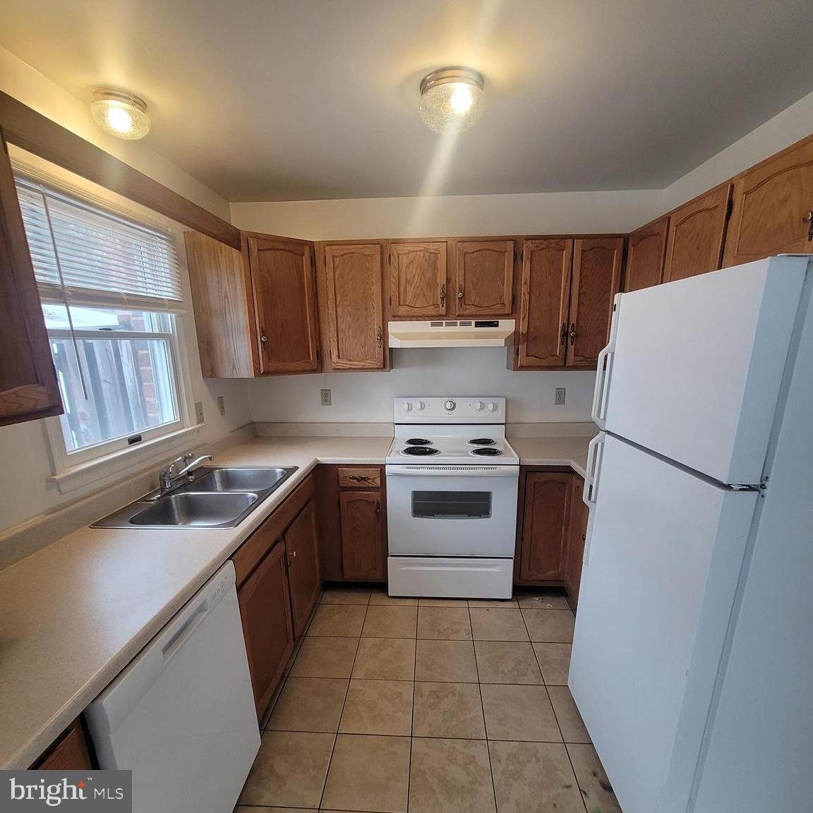 71 Leatherman Drive Falling Waters, WV 25419 - Photo 2 of 22 a kitchen with a stove a refrigerator and a sink