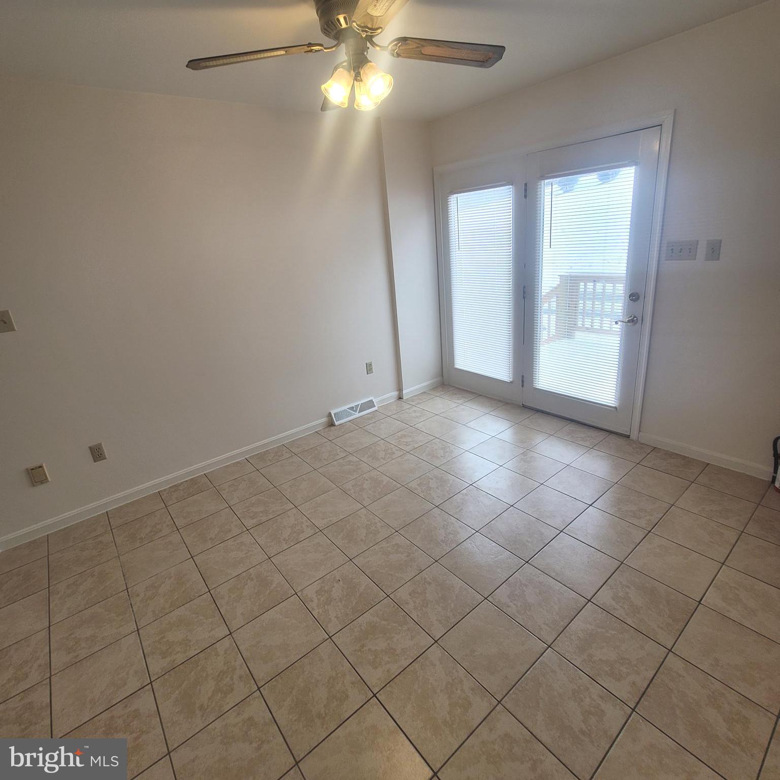 71 Leatherman Drive Falling Waters, WV 25419 - Photo 5 of 22 an empty room with windows and fan
