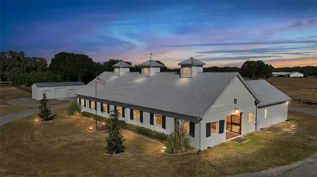 a bedroom with a bed and a flat tv screen on dresser