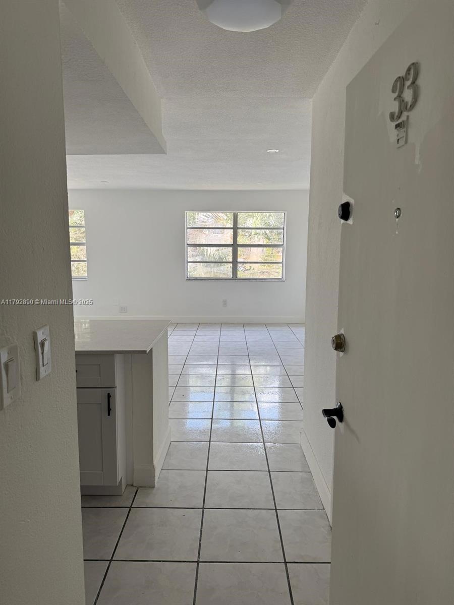 1350 West 53rd Street, Unit 33 Hialeah, FL 33012 - Photo 12 of 17 a view of a livingroom with a window