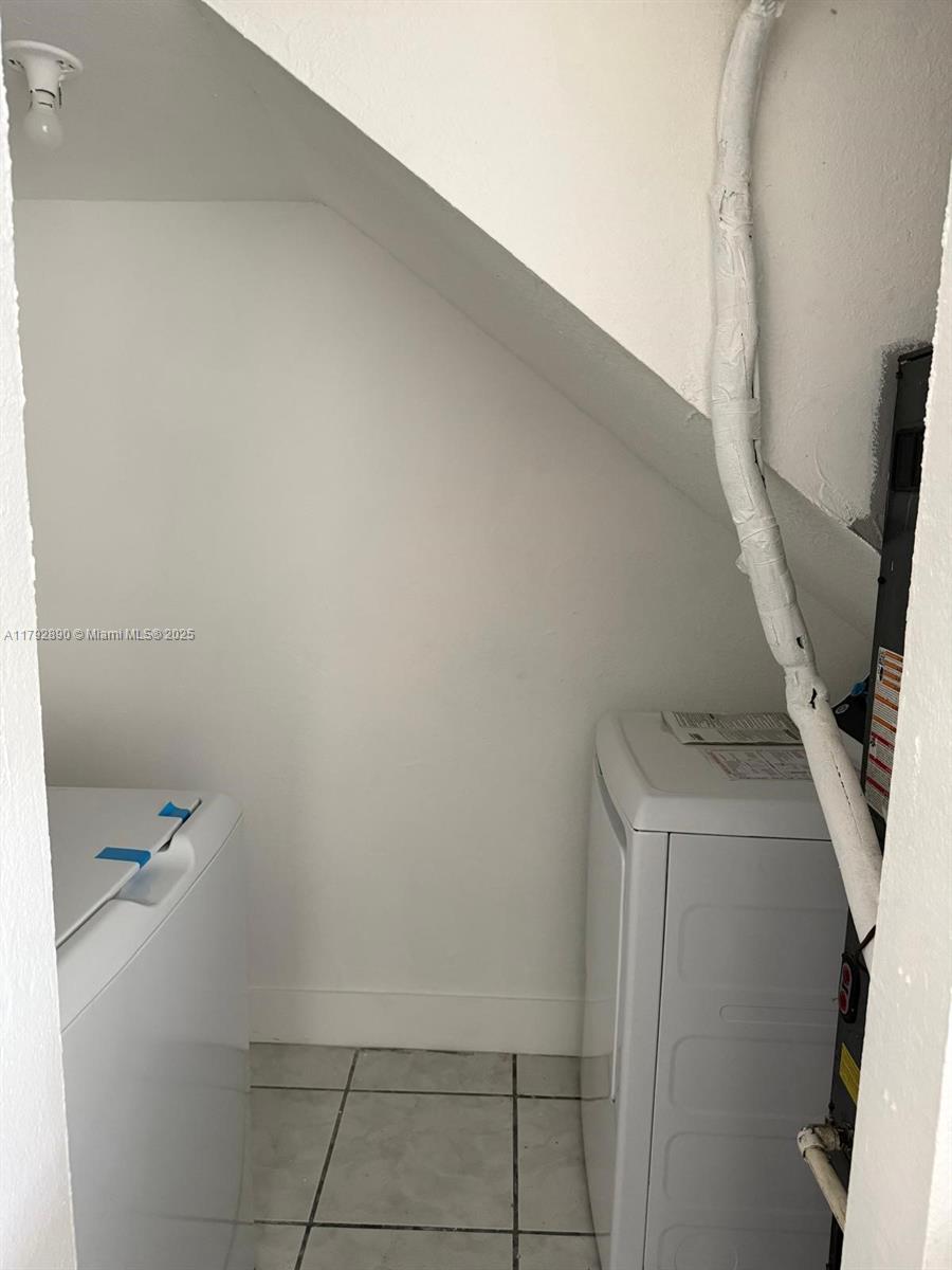 1350 West 53rd Street, Unit 33 Hialeah, FL 33012 - Photo 7 of 17 a view of utility room and closet