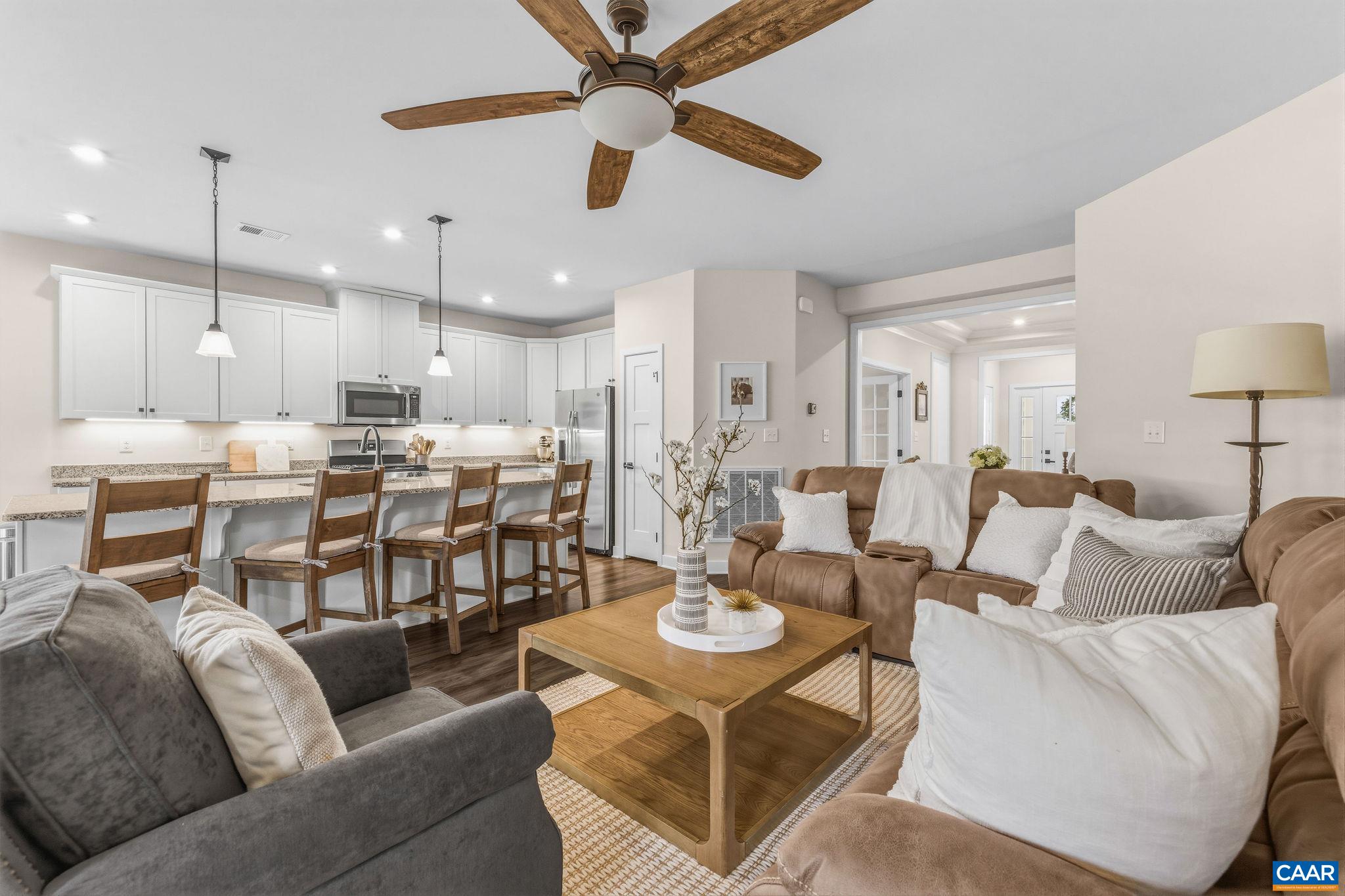 360 Winding Road Keswick, VA 22947 - Photo 15 of 48 a living room with furniture kitchen view and a chandelier
