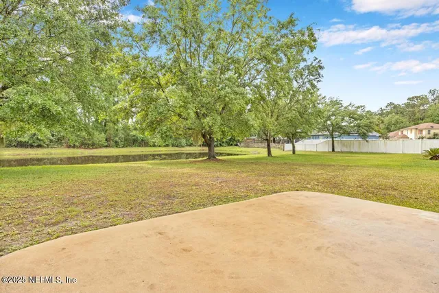 a view of a swimming pool and an outdoor space